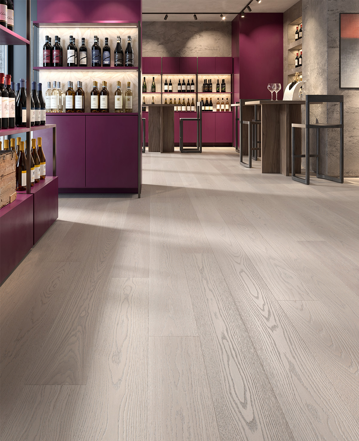 Parquet en chêne gris Nebula dans une cave à vin moderne avec mobilier bordeaux et tables hautes.